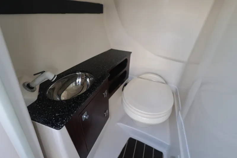 Slide: The Image of 2014 Monterey 268SS Super Sport boat bathroom with sink and toilet. - 32