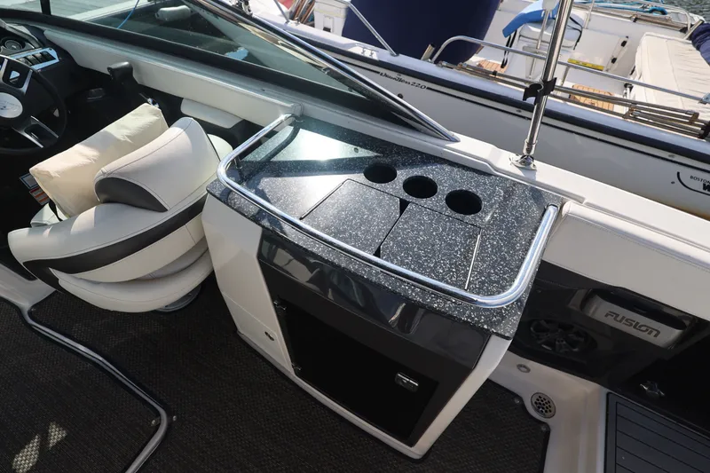 Slide: The Image of The cockpit of a 2014 Monterey 268SS Super Sport with a sleek dashboard and comfortable seating. - 16