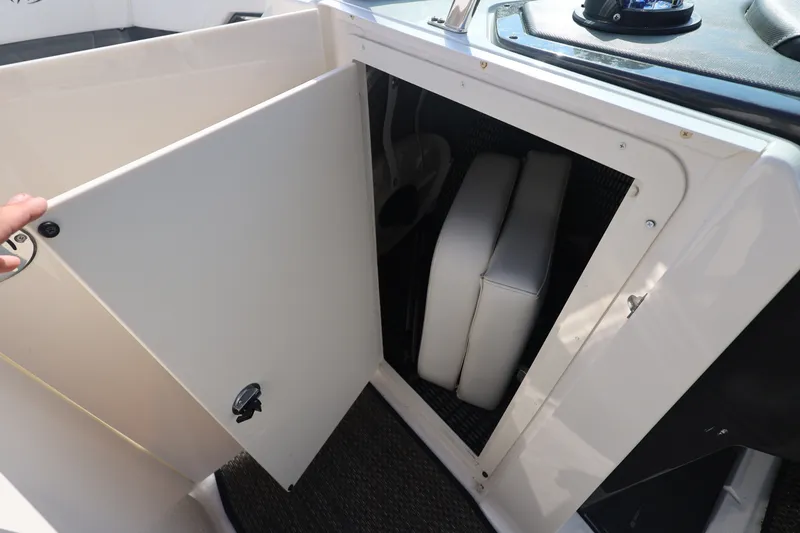 Slide: The Image of Storage compartment on a 2014 Monterey 268SS Super Sport boat, open with cushions inside. - 33