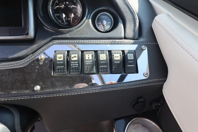 Slide: The Image of Control panel of a 2014 Monterey 268SS Super Sport boat with various switches. - 25