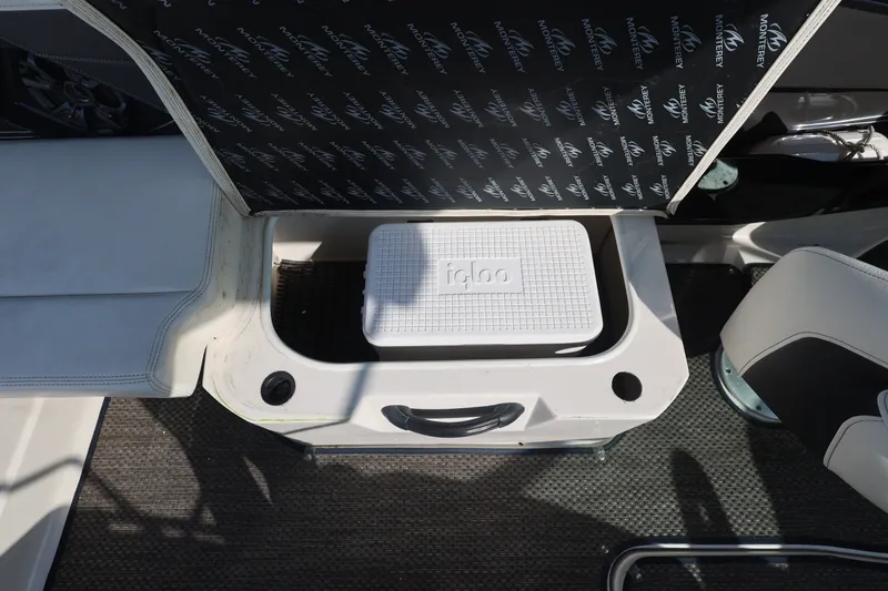 Slide: The Image of An Igloo cooler is stored in a compartment on a Monterey 268SS Super Sport boat. - 28