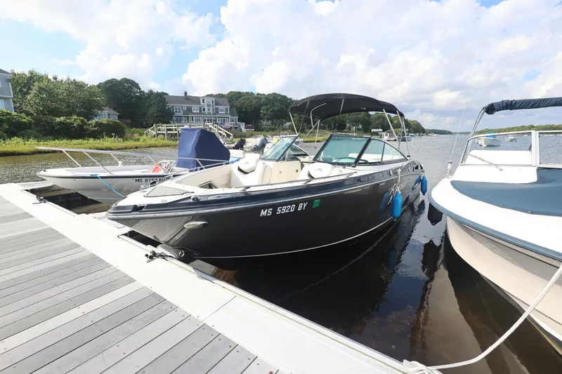 Slide: The Image of 2014 Monterey 268SS Super Sport boat docked on a sunny day. - 2