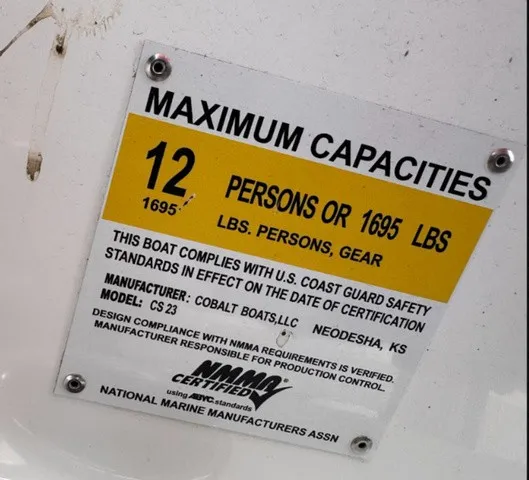 Slide: The Image of Capacity sign: 12 persons or 1695 lbs. Cobalt CS23, year 2019. - 13