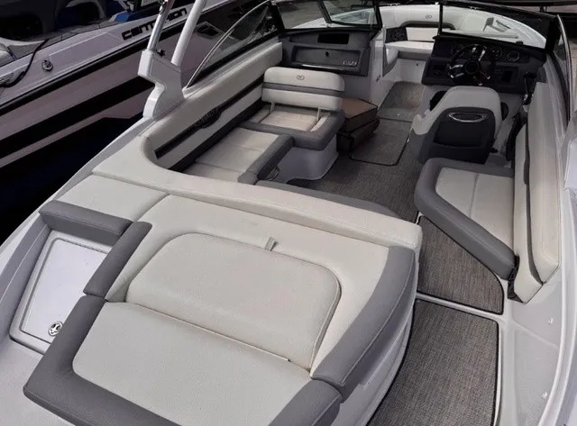 Slide: The Image of The image shows the interior of a 2019 Cobalt CS23 boat with gray and white seating. - 8