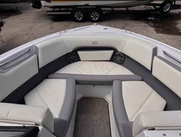 Slide: The Image of The image shows the bow area of a 2019 Cobalt CS23 boat with gray and white upholstery. - 9