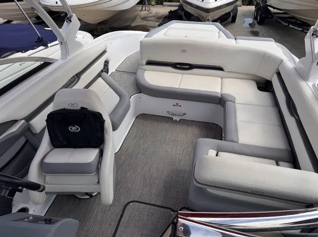 Slide: The Image of The image shows the interior of a 2019 Cobalt CS23 boat with white and gray seating. - 4