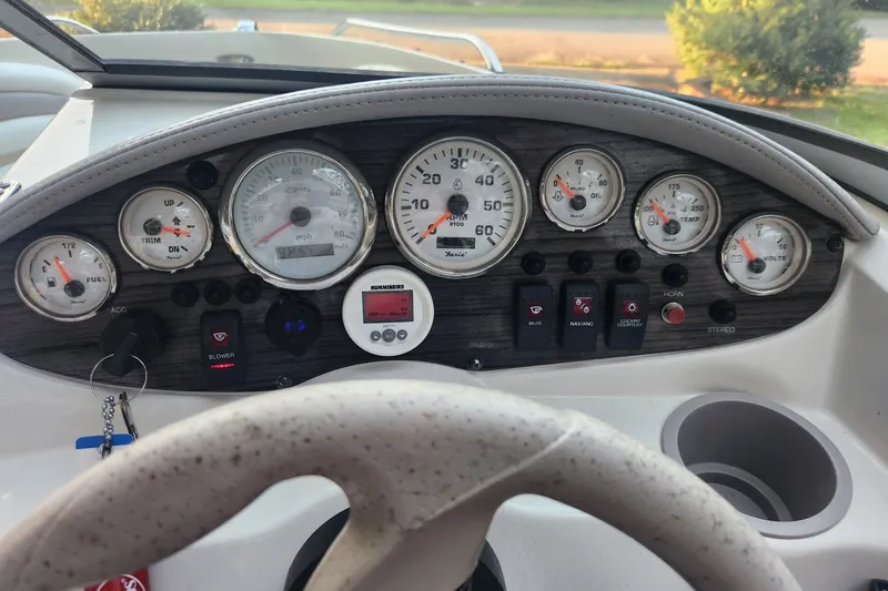 Slide: The Image of Dashboard of a 2008 Stingray 185 LS/LX boat with gauges and controls. - 5