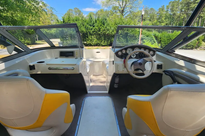 Slide: The Image of 2008 Stingray 185 LS/LX boat interior with dual seats and steering wheel. - 4
