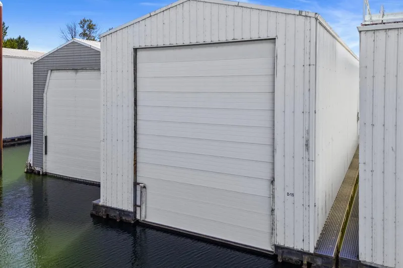 Slide: The Image of Custom All Steel Boathouse, 2008 model, floating on water with closed doors. - 7