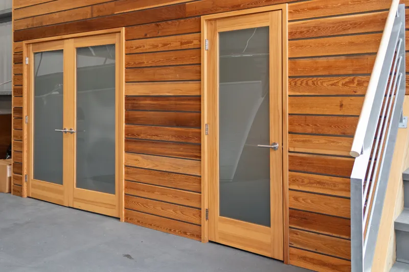 Slide: The Image of Wood-paneled boathouse doors with frosted glass, Custom All Steel Boathouse, 1969 design. - 32