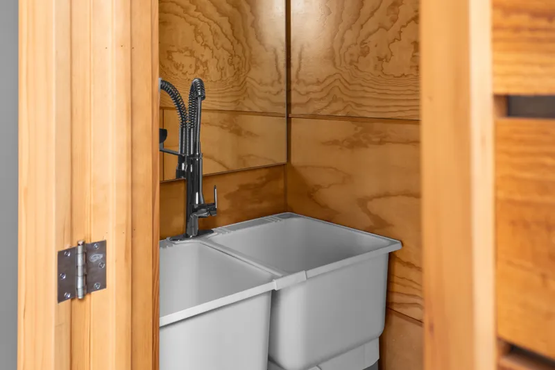 Slide: The Image of Wood-paneled utility sink with modern faucet in 1969 Custom All Steel Boathouse. - 40