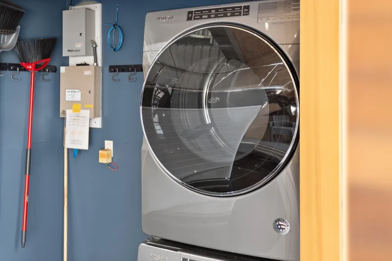 Slide: The Image of Modern Whirlpool dryer in a 1969 custom all-steel boathouse, with cleaning tools nearby. - 34