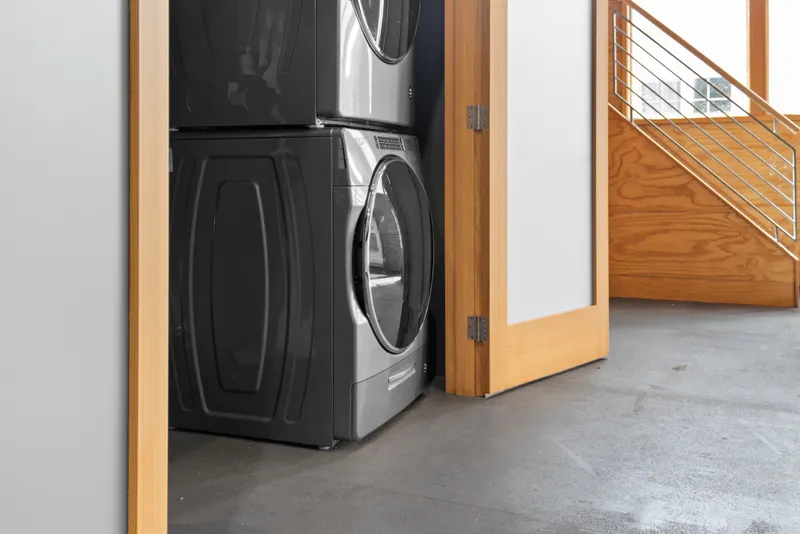 Slide: The Image of Stacked washer and dryer in modern boathouse interior, Custom All Steel Boathouse, 1969. - 36