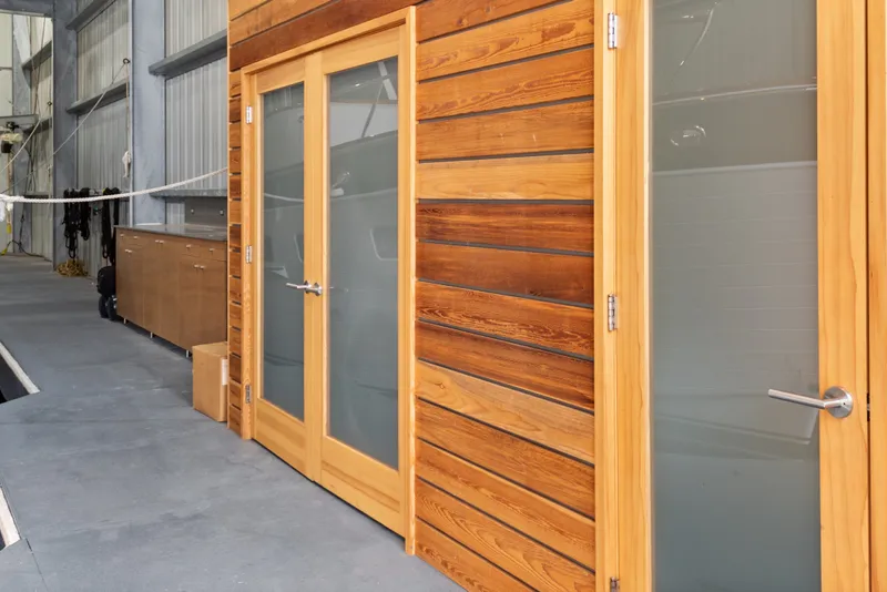 Slide: The Image of Wooden doors and siding in a 1969 custom all-steel boathouse interior. - 31