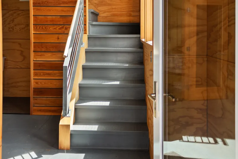 Slide: The Image of Modern steel staircase in a 1969 custom all-steel boathouse with wooden accents. - 43