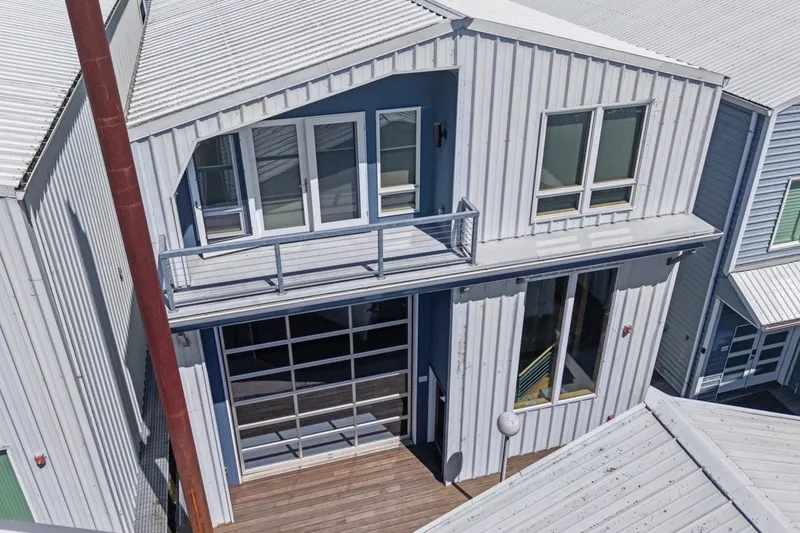 Slide: The Image of Modern custom all-steel boathouse with large windows and balcony, built in 2008. - 2