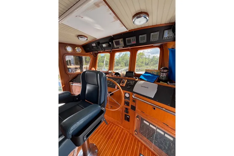 Slide: The Image of Interior of 1988 Hans Christian Independence 45 yacht with navigation equipment and captain's chair. - 9