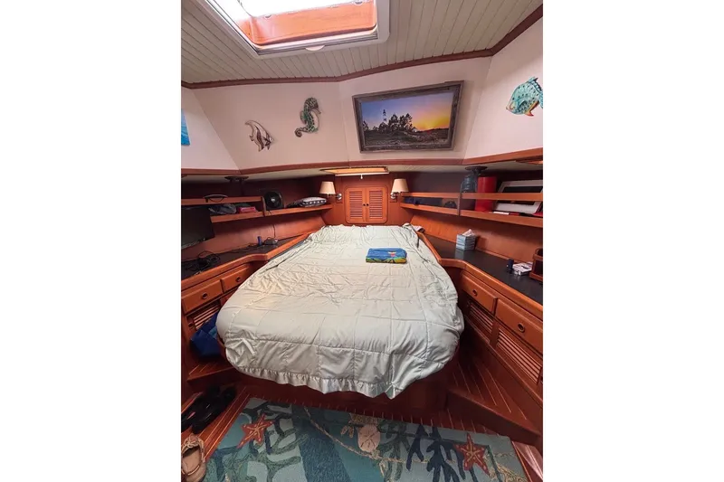 Slide: The Image of Cozy cabin interior of 1988 Hans Christian Independence 45 yacht with bed and wooden furnishings. - 15