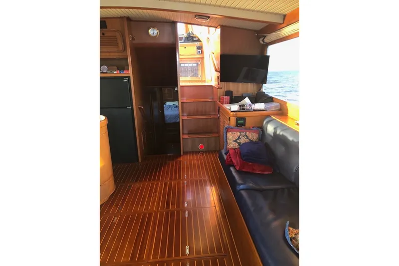 Slide: The Image of Interior of 1988 Hans Christian Independence 45 yacht with wooden flooring and cozy seating. - 11