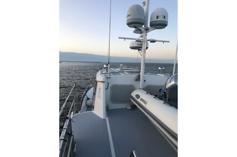 Slide: The Image of Deck view of 1988 Hans Christian Independence 45 yacht at sea during sunset. - 3