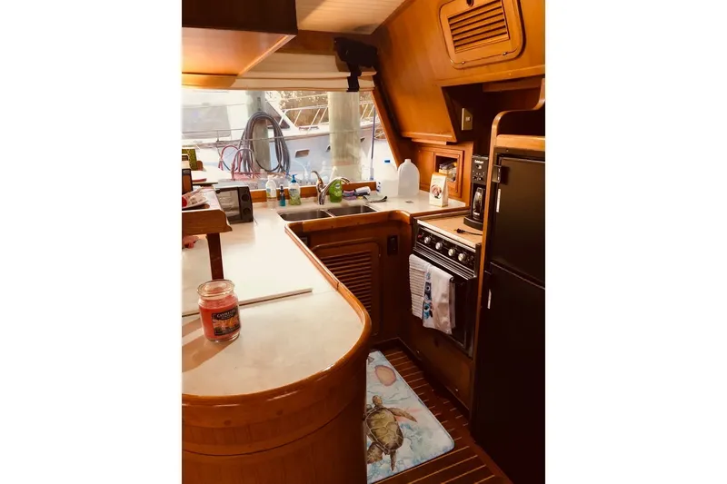 Slide: The Image of Cozy kitchen interior of 1988 Hans Christian Independence 45 yacht with wooden cabinetry. - 16