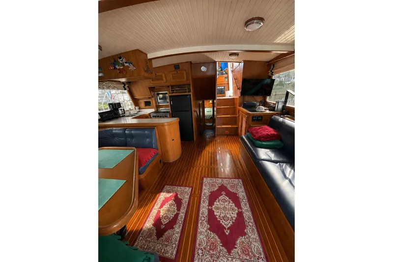 Slide: The Image of Interior of 1988 Hans Christian Independence 45 yacht with wood finish and cozy seating. - 5