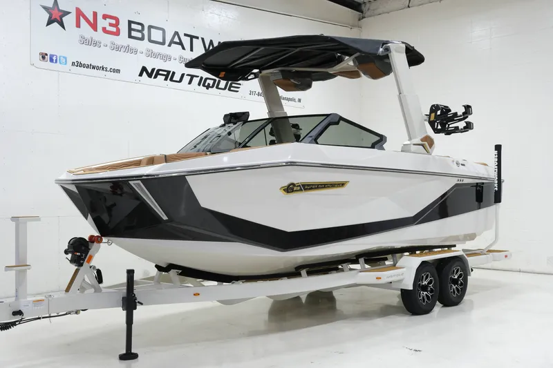 Slide: The Image of A modern 2027 Nautique G23 on a trailer in a showroom. - 5