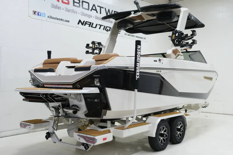 Slide: The Image of A modern 2027 Nautique G23 on a trailer in a showroom. - 3