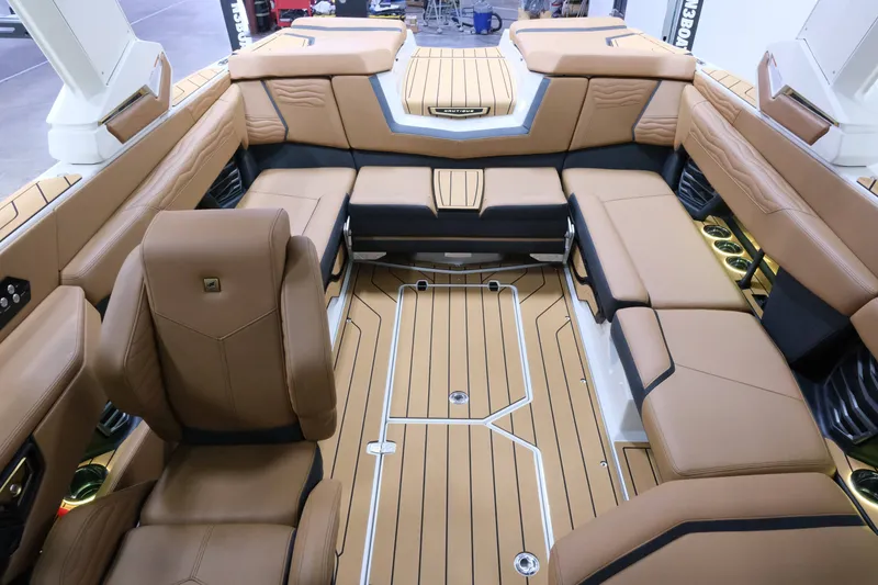 Slide: The Image of The image shows the luxurious interior of a Nautique G23 boat with sleek leather seating. - 17