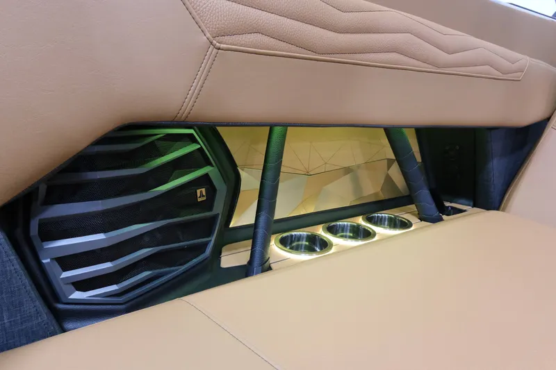 Slide: The Image of The image shows the interior of a Nautique G23 boat with sleek leather seating and built-in speakers. - 19
