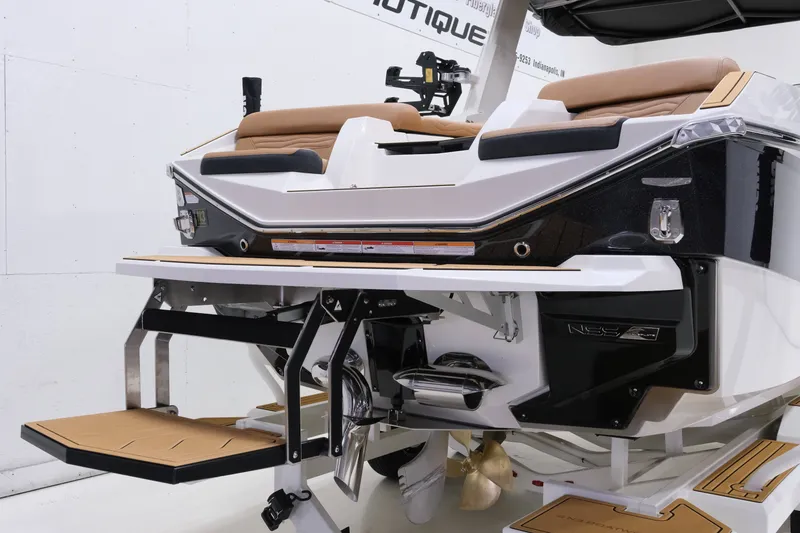 Slide: The Image of The image shows the stern of a 2027 Nautique G23 boat with modern design elements. - 8
