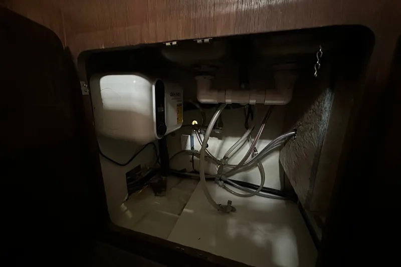 Slide: The Image of Interior view of a 1980 Morgan 415 Ketch showing plumbing and equipment. - 23