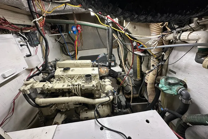 Slide: The Image of Engine room of a 1980 Morgan 415 Ketch sailboat, showcasing complex wiring and machinery. - 10