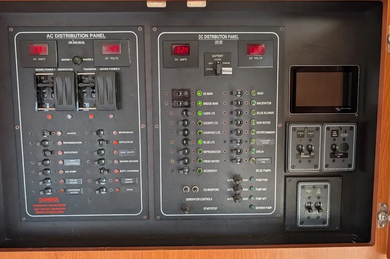 Slide: The Image of Electrical control panel on a 2008 Mainship 34 Trawler boat. - 53