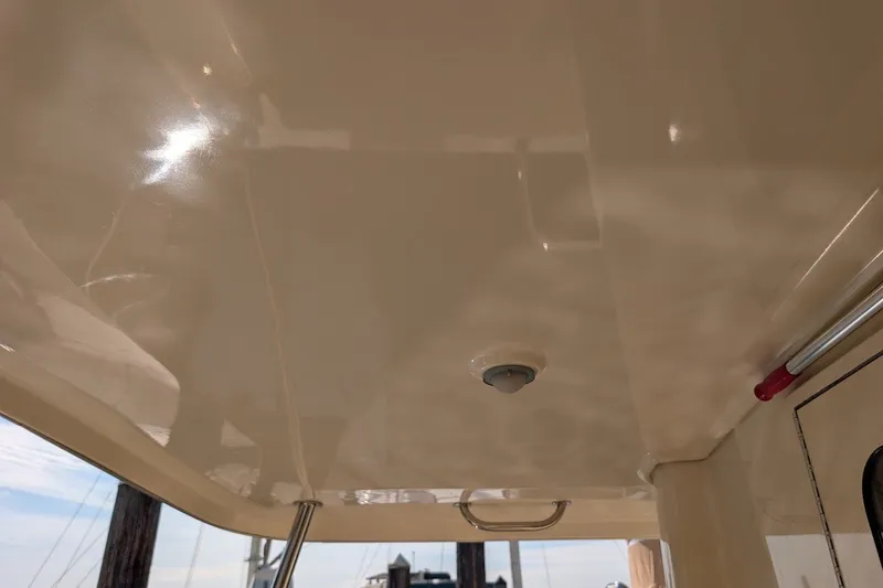 Slide: The Image of 2008 Mainship 34 Trawler ceiling with light fixture and handrail. - 45