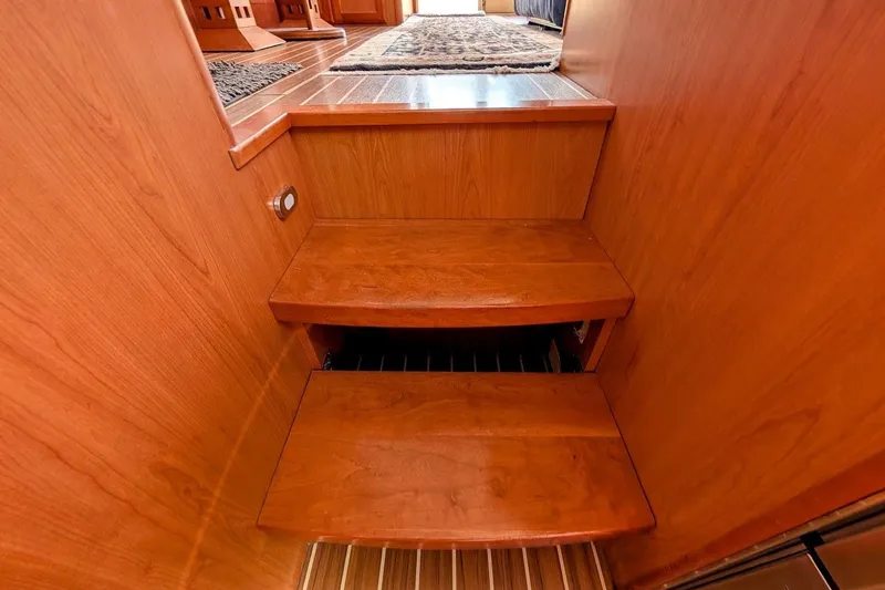 Slide: The Image of Wooden interior stairs on a 2008 Mainship 34 Trawler yacht. - 30