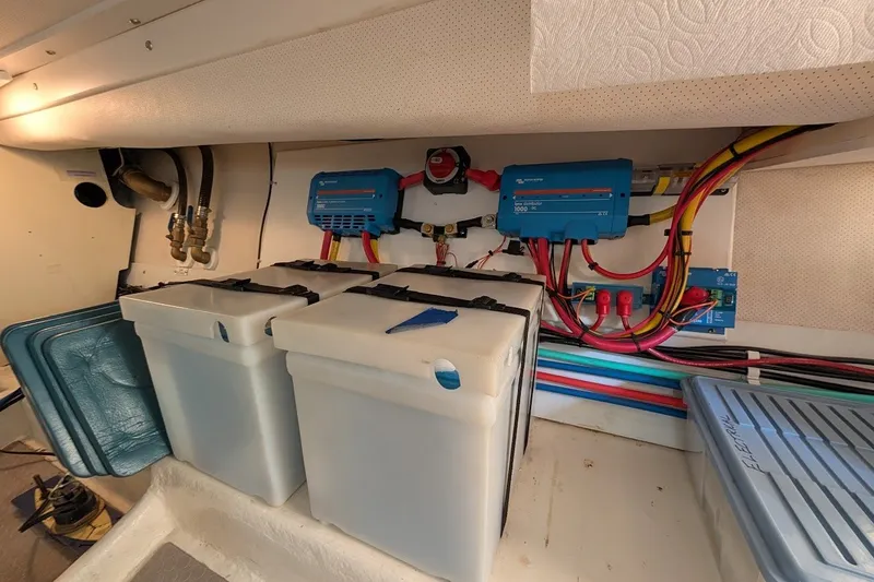 Slide: The Image of Electrical system of a 2008 Mainship 34 Trawler, featuring batteries and wiring. - 49