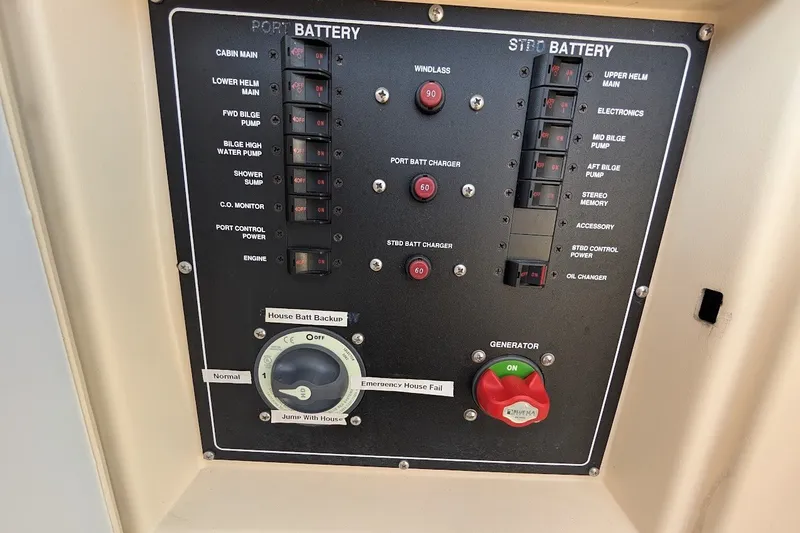 Slide: The Image of Electrical control panel on a 2008 Mainship 34 Trawler boat. - 52