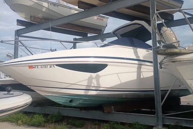 The Image of 2018 Regal 28 Express boat in dry storage, side view. - 0
