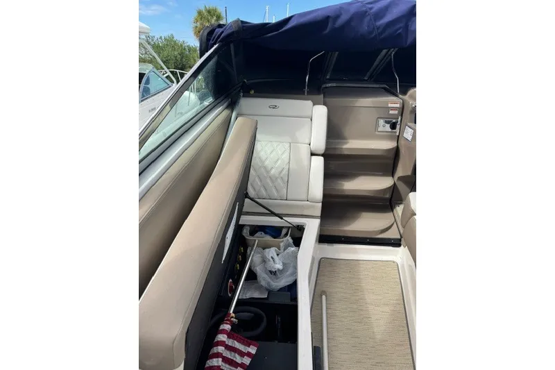 Slide: The Image of Interior of a 2018 Regal 28 Express boat with seating and steps. - 9