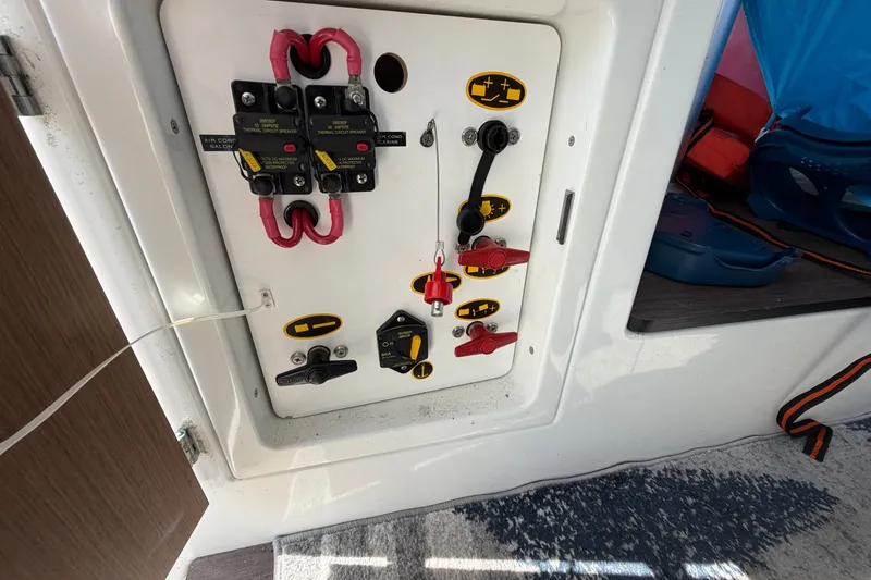Slide: The Image of Electrical panel on a 2021 Beneteau Antares 27 boat, featuring switches and wiring. - 38