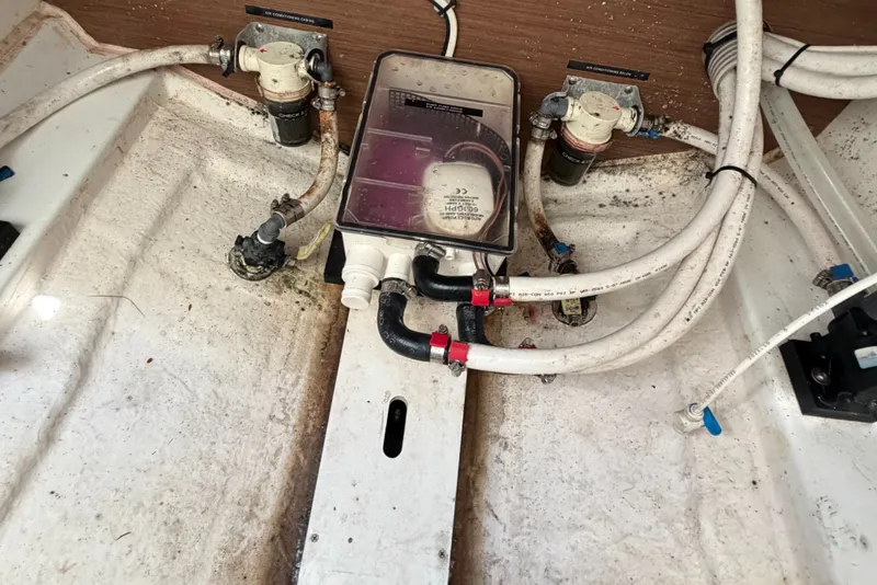 Slide: The Image of Bilge area of a 2021 Beneteau Antares 27 with plumbing and pump system. - 39