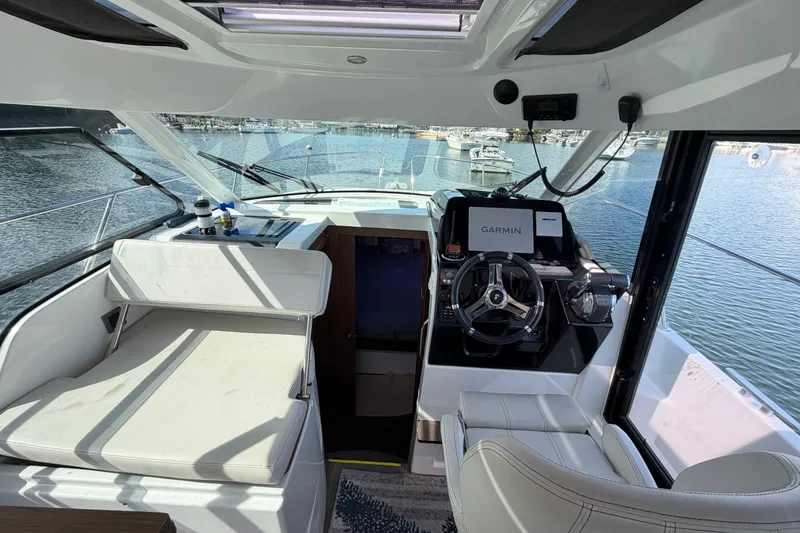 Slide: The Image of Interior of a 2021 Beneteau Antares 27 boat with Garmin navigation system. - 12
