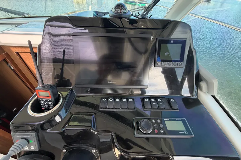 Slide: The Image of Cockpit of 2021 Beneteau Antares 27 with navigation and communication equipment. - 21