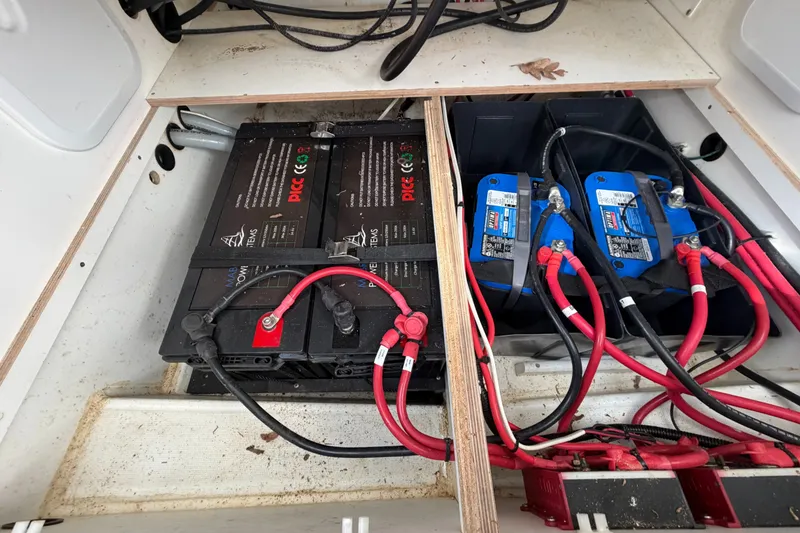 Slide: The Image of Battery compartment of a 2021 Beneteau Antares 27 with wiring and connections. - 40