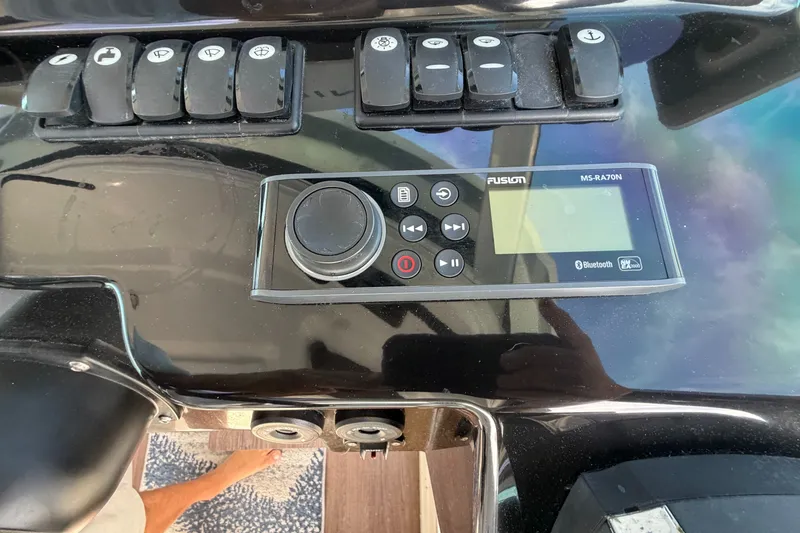 Slide: The Image of Control panel of a 2021 Beneteau Antares 27 with Fusion MS-RA70N audio system. - 24