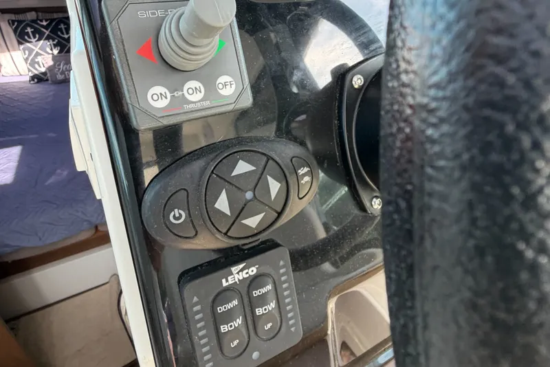 Slide: The Image of Control panel of a 2021 Beneteau Antares 27 boat with joystick and buttons. - 23