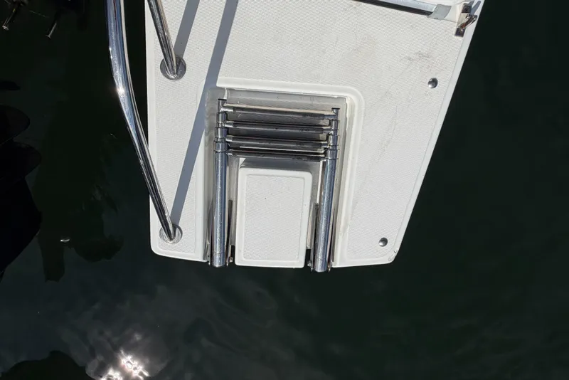 Slide: The Image of Foldable swim ladder on a 2021 Beneteau Antares 27 boat. - 41