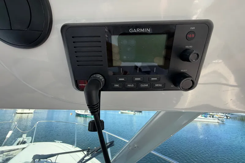 Slide: The Image of Garmin marine radio on 2021 Beneteau Antares 27 boat, overlooking marina. - 25