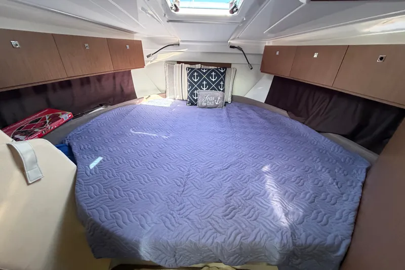 Slide: The Image of Cozy cabin interior of 2021 Beneteau Antares 27 with nautical-themed decor. - 32